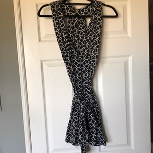 Tart super chic minidress or coverup with plunging neckline and peekaboo back.